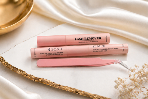 Lash remover, bond and seal, and tweezers in pink packaging